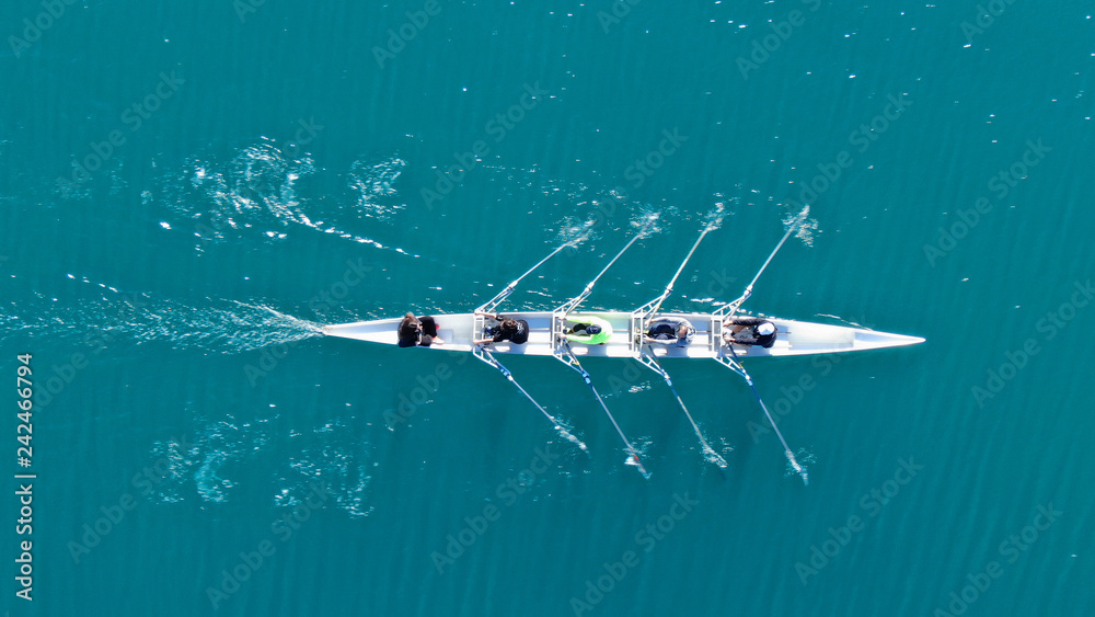 Aerial rowing scull — precision, synchronization, forward momentum